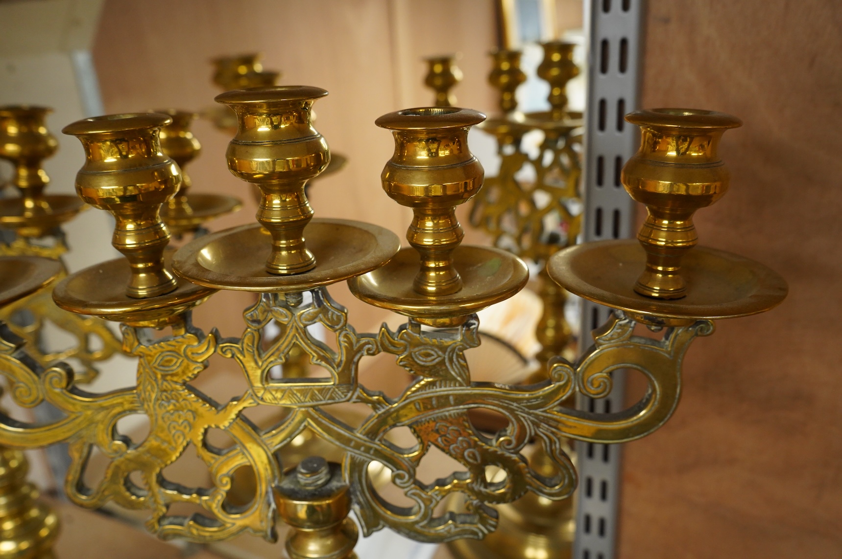 A pair of Juddah Sabbath five light brass candlesticks, 50cm high